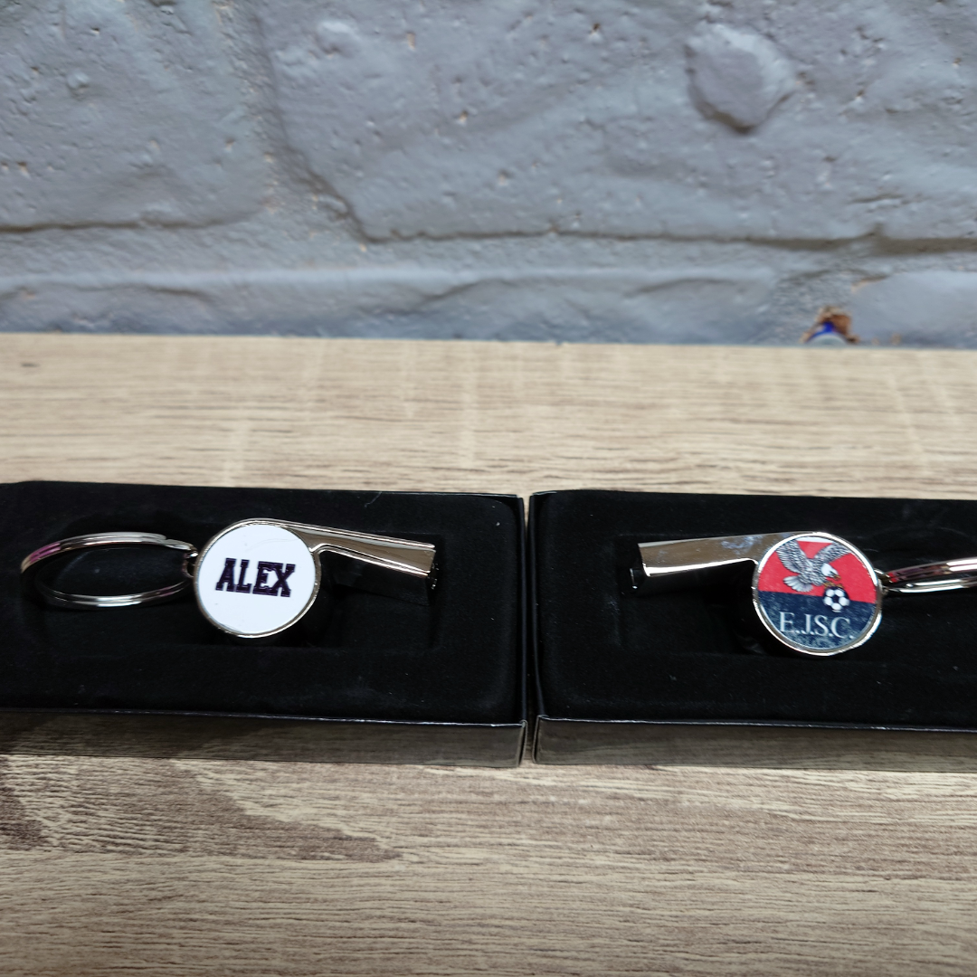 Custom printed whistle keyring gift for coach or teacher, personalised with name and team logo, displayed in gift box from Newie Print Co.