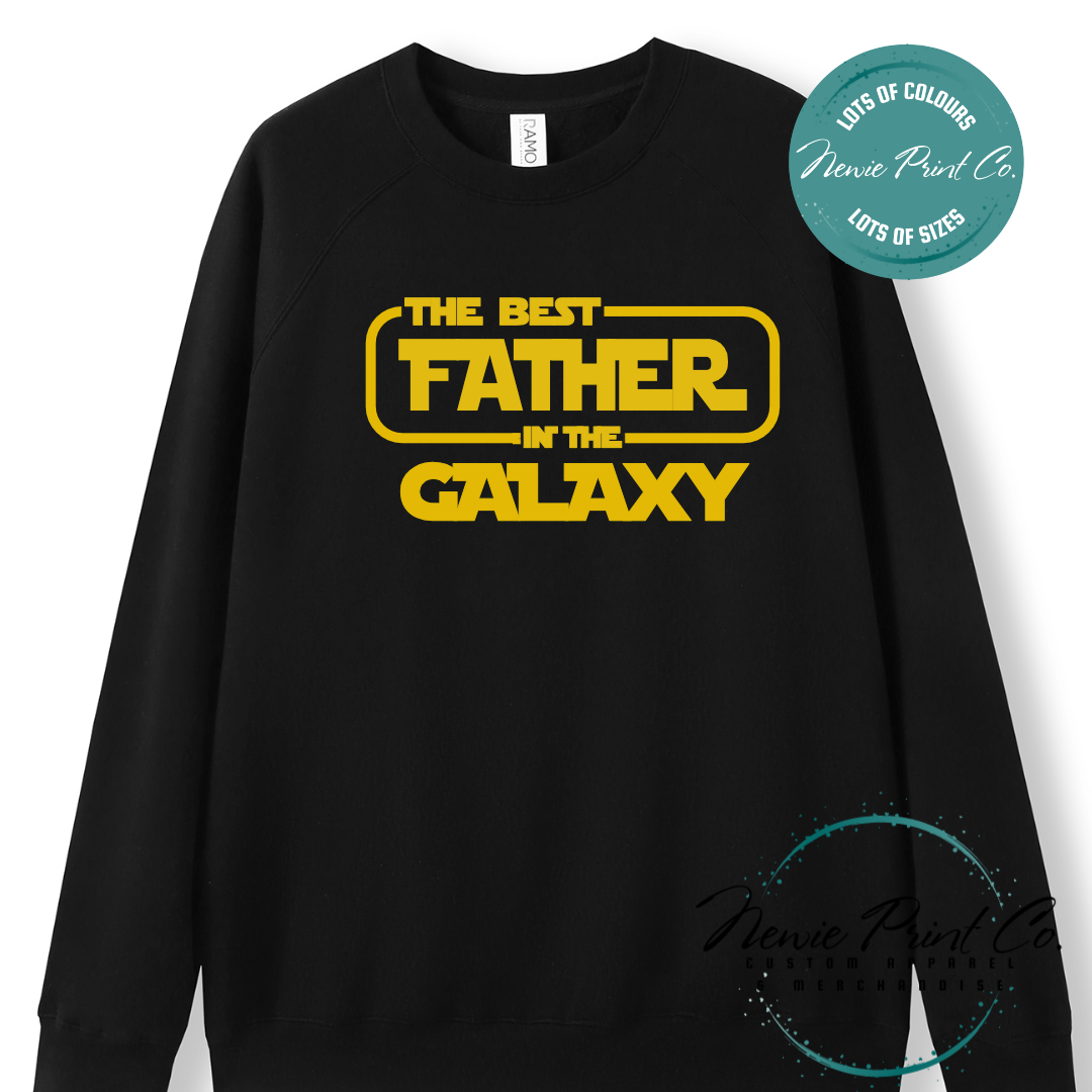Funny t-shirt and jumper with the text “Best Father in the Galaxy customizable Humorous Star Wars-inspired quote printed on 100% cotton apparel using high-quality DTF/DTG print. Perfect gift for dads, Father’s Day.