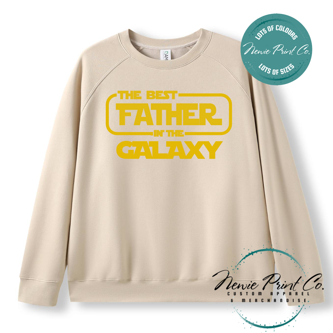 Funny t-shirt and jumper with the text “Best Father in the Galaxy customizable Humorous Star Wars-inspired quote printed on 100% cotton apparel using high-quality DTF/DTG print. Perfect gift for dads, Father’s Day.