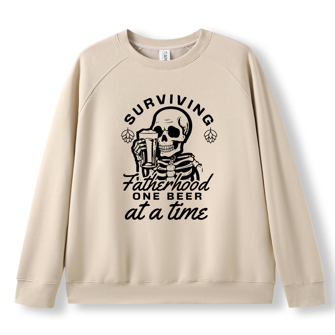Funny t-shirt and jumper with the phrase “Surviving Fatherhood One Beer at a Time” featuring a skeleton holding a beer. Printed on soft cotton with high-quality DTF/DTG printing. Perfect humorous gift for dads, beer lovers, and Father's Day.