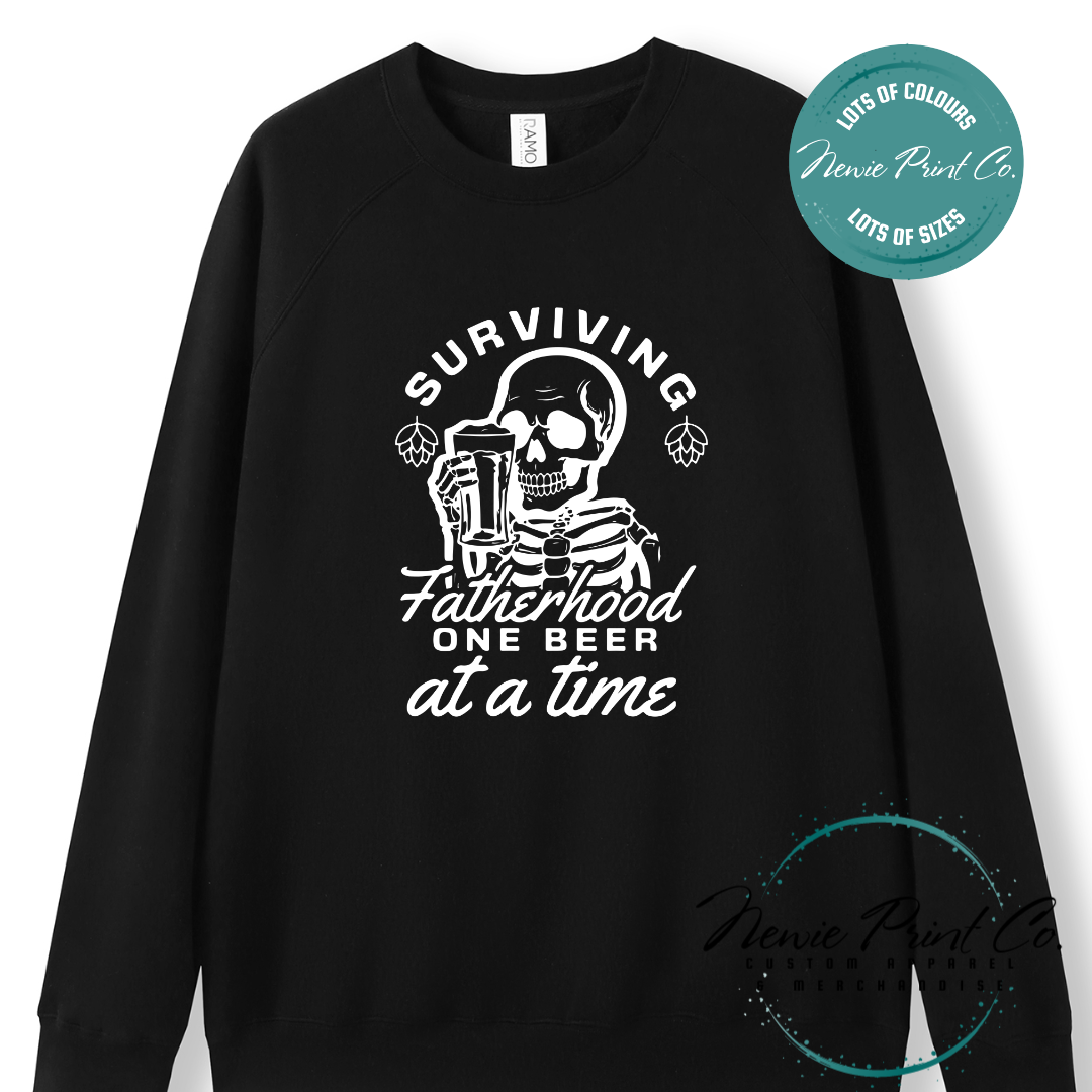 Funny t-shirt and jumper with the phrase “Surviving Fatherhood One Beer at a Time” featuring a skeleton holding a beer. Printed on soft cotton with high-quality DTF/DTG printing. Perfect humorous gift for dads, beer lovers, and Father's Day.