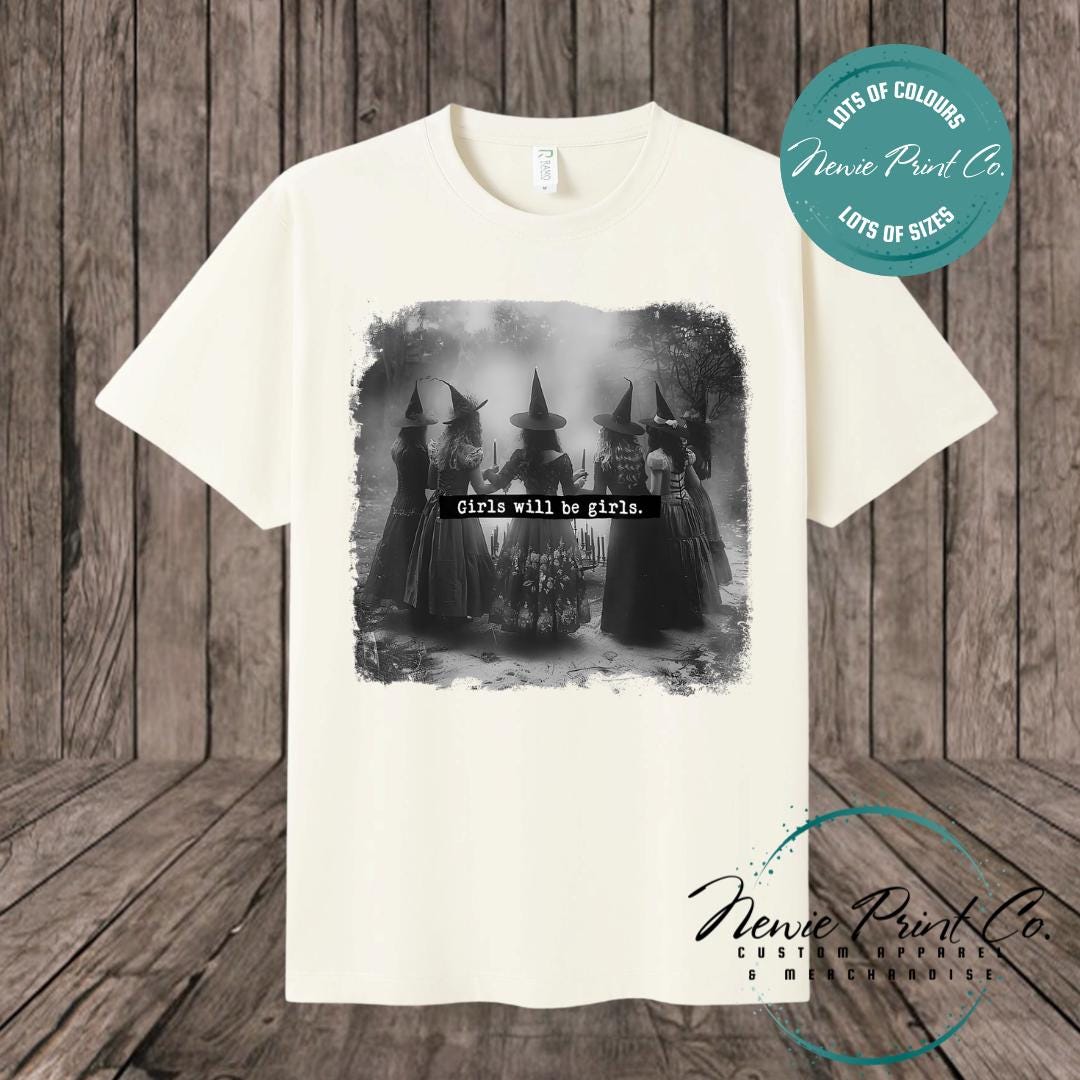 Witches in the forest design on custom t-shirt with the slogan “Girls Will Be Girls”. Feminist and empowering print on 100% cotton tee, perfect for girls and women, printed using high-quality DTF/DTG technology.