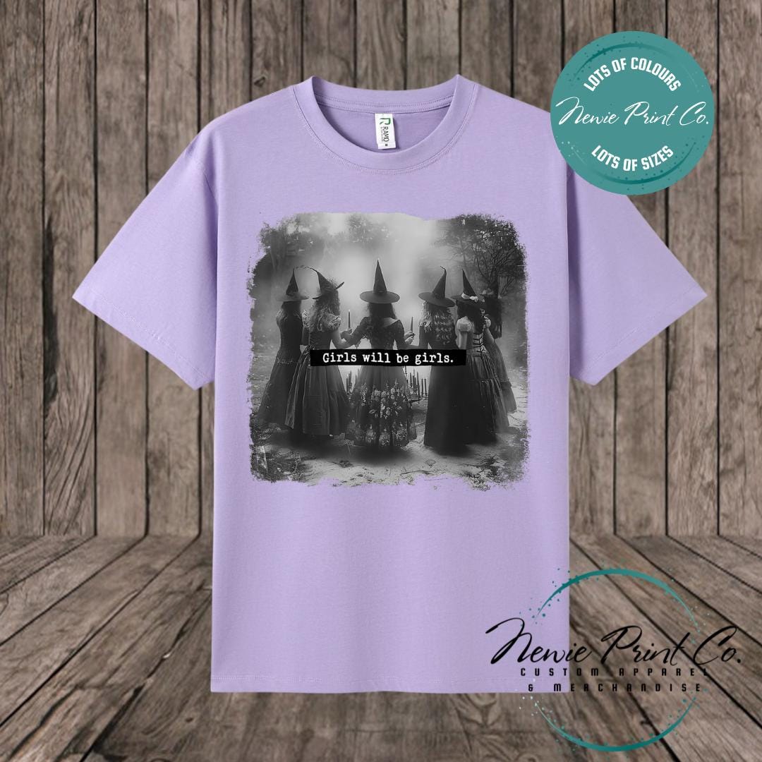 Witches in the forest design on custom t-shirt with the slogan “Girls Will Be Girls”. Feminist and empowering print on 100% cotton tee, perfect for girls and women, printed using high-quality DTF/DTG technology.
