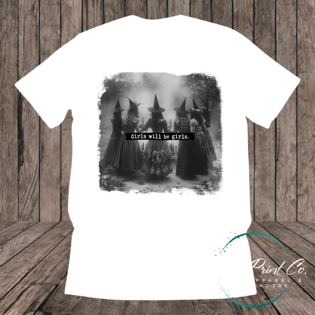 Witches in the forest design on custom t-shirt with the slogan “Girls Will Be Girls”. Feminist and empowering print on 100% cotton tee, perfect for girls and women, printed using high-quality DTF/DTG technology.