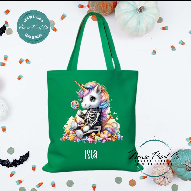 Custom Halloween tote bag with unicorn dressed as a skeleton surrounded by lollies and candy, optional personalised name printed on the front, perfect for trick-or-treating or spooky season gifts