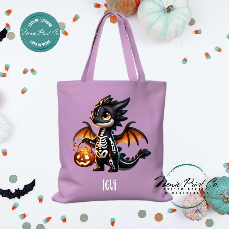 Custom Halloween tote bag with a cute black and orange dragon holding a pumpkin, optional personalised name printed on the front, perfect for trick-or-treating or spooky season gifts Printed in Australia.