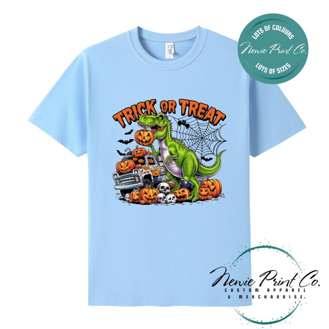 Custom Halloween t-shirts printed in Australia, featuring a spooky dinosaur and monster truck design and optional personalised names — perfect for Halloween parties, school events, or family matching outfits.