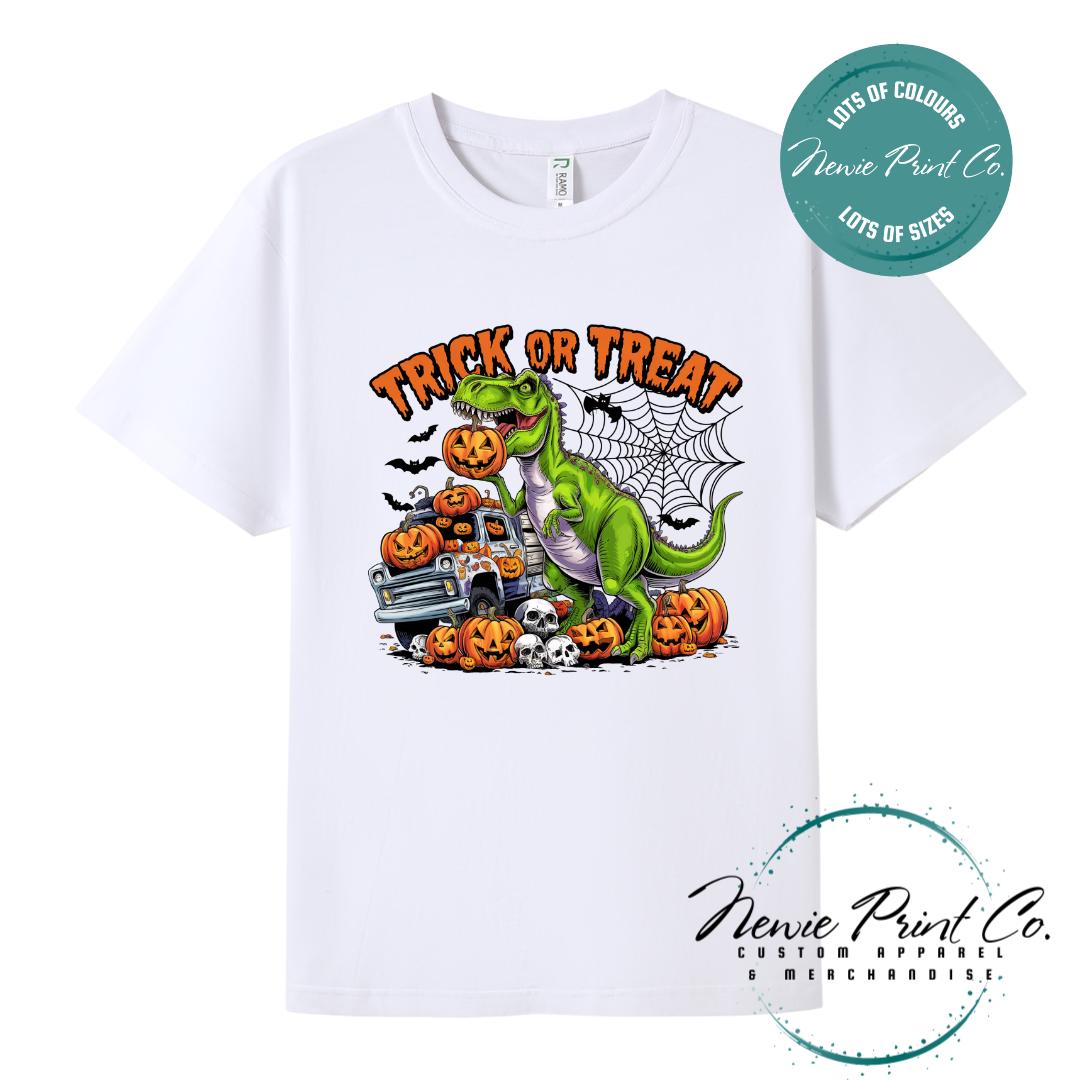 Custom Halloween t-shirts printed in Australia, featuring a spooky dinosaur and monster truck design and optional personalised names — perfect for Halloween parties, school events, or family matching outfits.