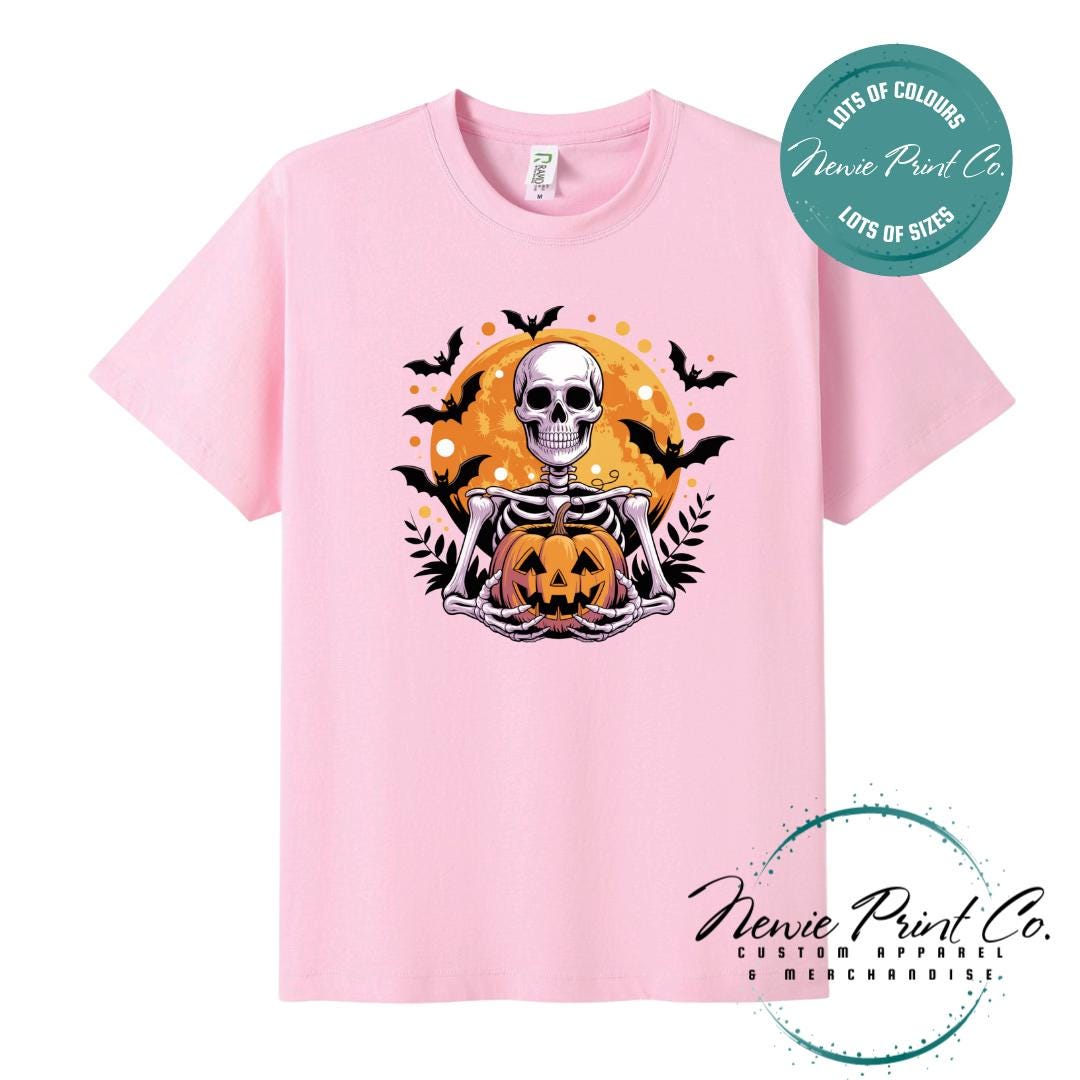 Custom Halloween t-shirts printed by Newie Print Co, featuring spooky skeleton design and optional personalised names — perfect for Halloween parties, school events, or family matching outfits.