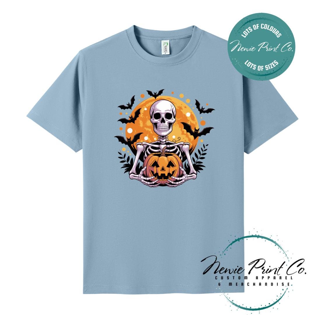 Custom Halloween t-shirts printed by Newie Print Co, featuring spooky skeleton design and optional personalised names — perfect for Halloween parties, school events, or family matching outfits.