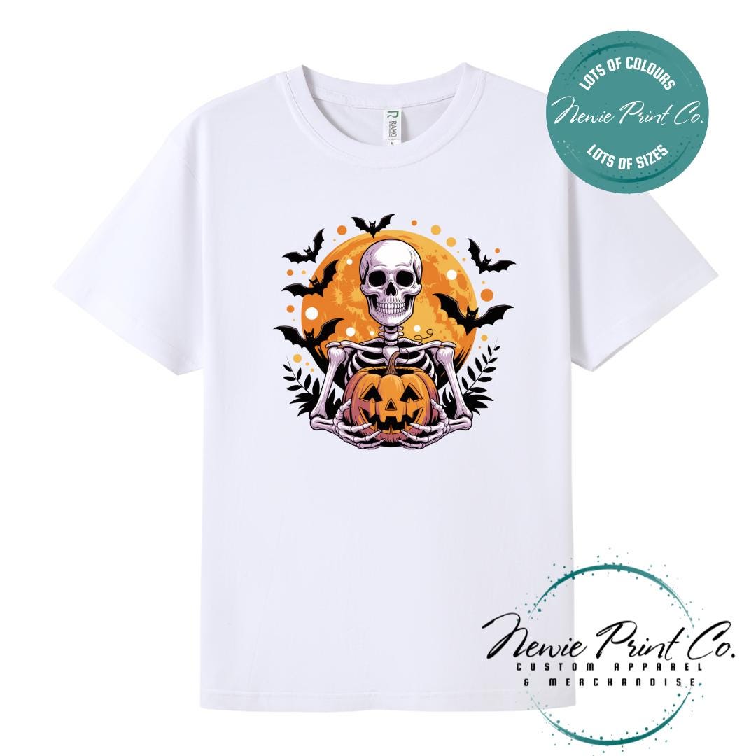 Custom Halloween t-shirts printed by Newie Print Co, featuring spooky skeleton design and optional personalised names — perfect for Halloween parties, school events, or family matching outfits.
