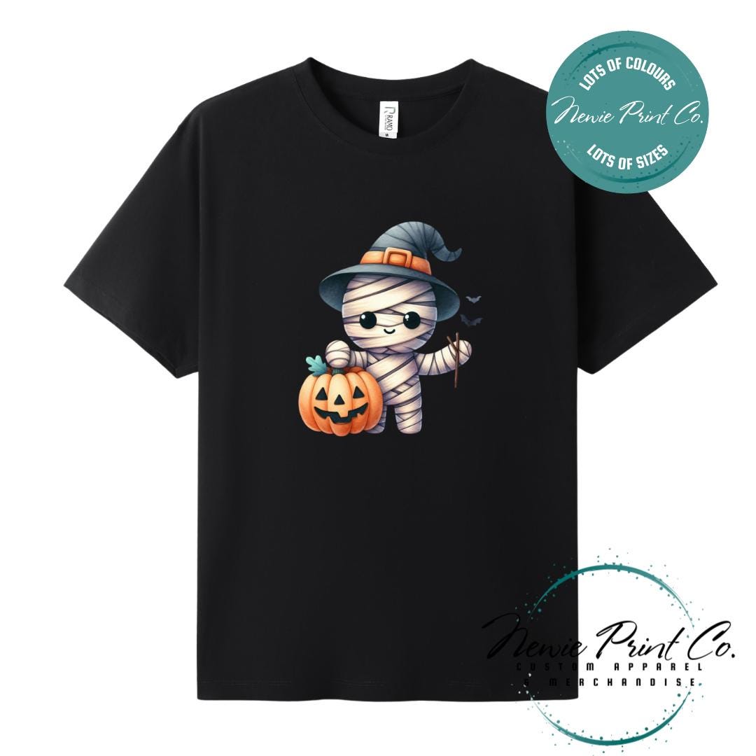 Custom Halloween t-shirts printed in Australia, featuring a cute but spooky mummy witch design and optional personalised names — perfect for Halloween parties, school events, or family matching outfits.