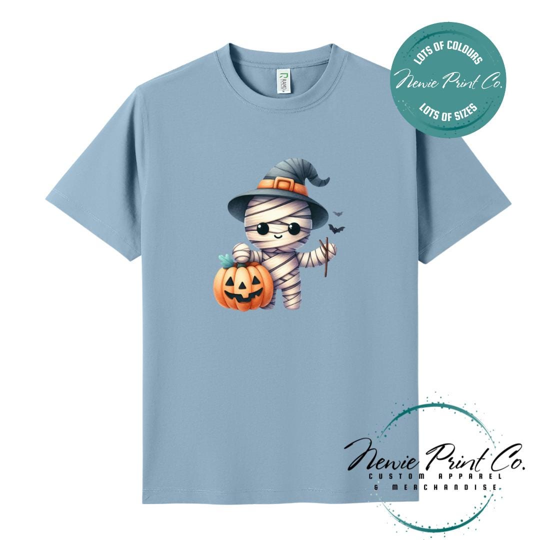 Custom Halloween t-shirts printed in Australia, featuring a cute but spooky mummy witch design and optional personalised names — perfect for Halloween parties, school events, or family matching outfits.