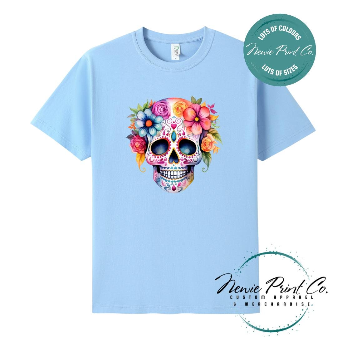 Custom Halloween t-shirts printed in Australia, featuring a floral sugar skull design and optional personalised names — perfect for Halloween parties, school events, or family matching outfits.