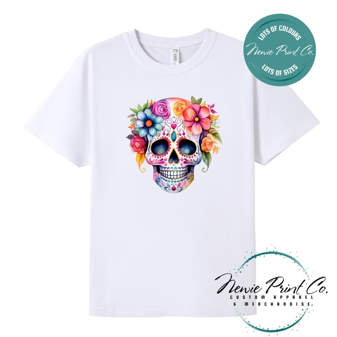 Custom Halloween t-shirts printed in Australia, featuring a floral sugar skull design and optional personalised names — perfect for Halloween parties, school events, or family matching outfits.