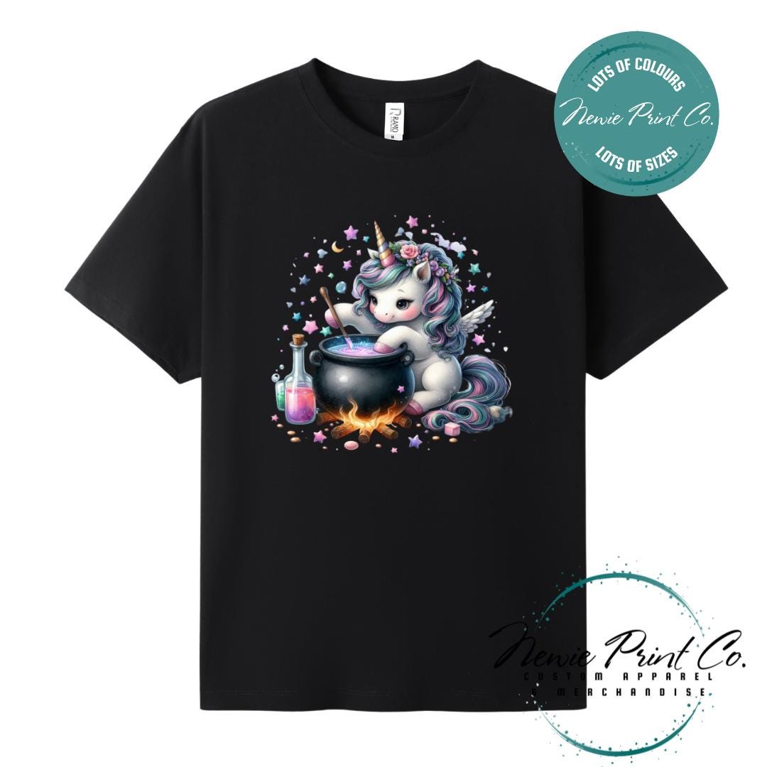 Custom Halloween t-shirts printed in Australia, featuring a cute and spooky unicorn and cauldron design and optional personalised names — perfect for Halloween parties, school events, or family matching outfits.