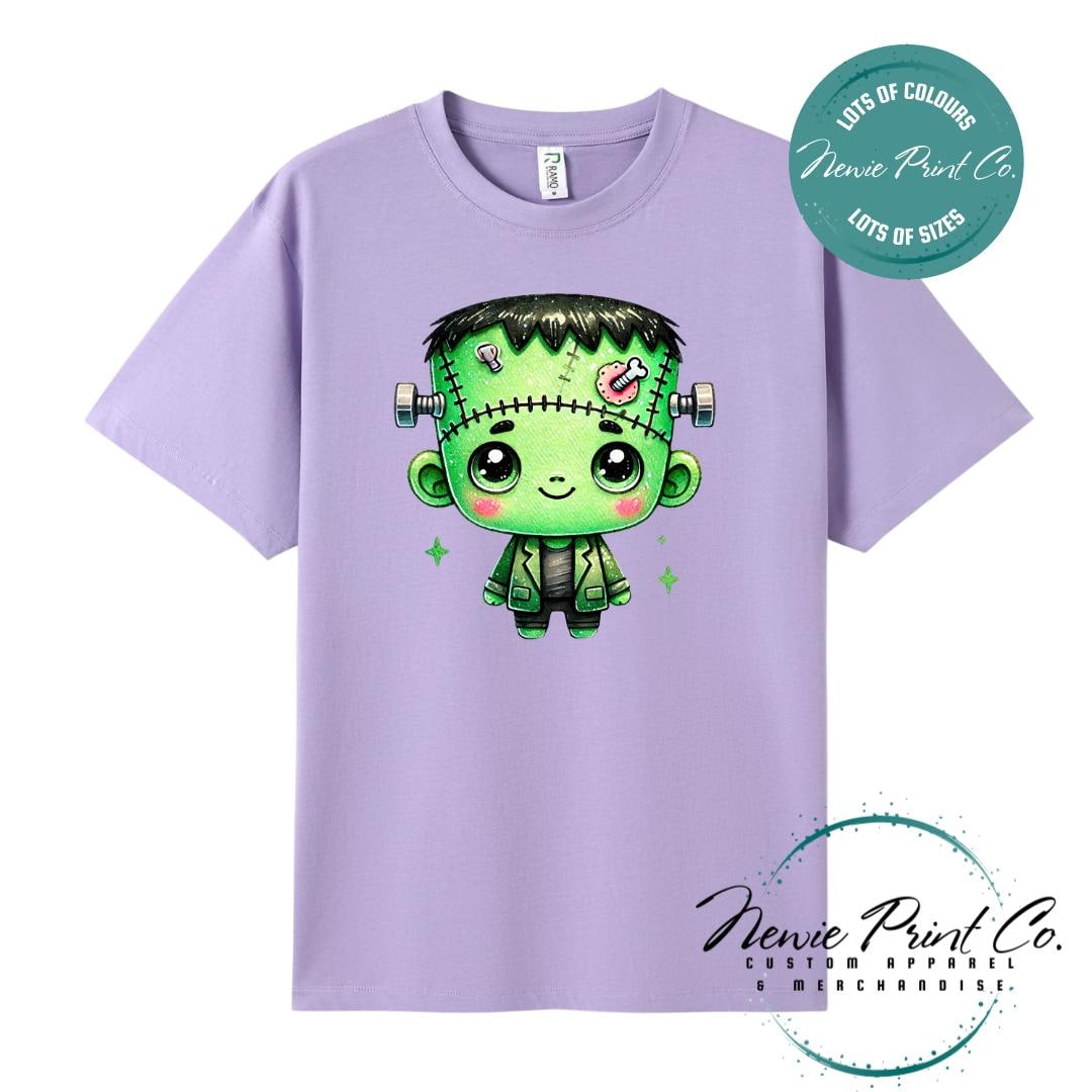 Custom Halloween t-shirts printed by in Australia by Newie Print Co, featuring a cute and spooky zombie Frankenstein and optional personalised names — perfect for Halloween parties, school events, or family matching outfits.
