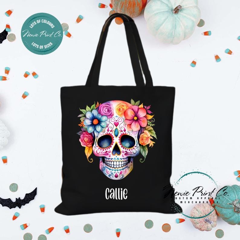 Custom Halloween tote bag with a bright floral sugar skull, optional personalised name printed on the front, perfect for trick-or-treating or spooky season gifts printed in Australia.