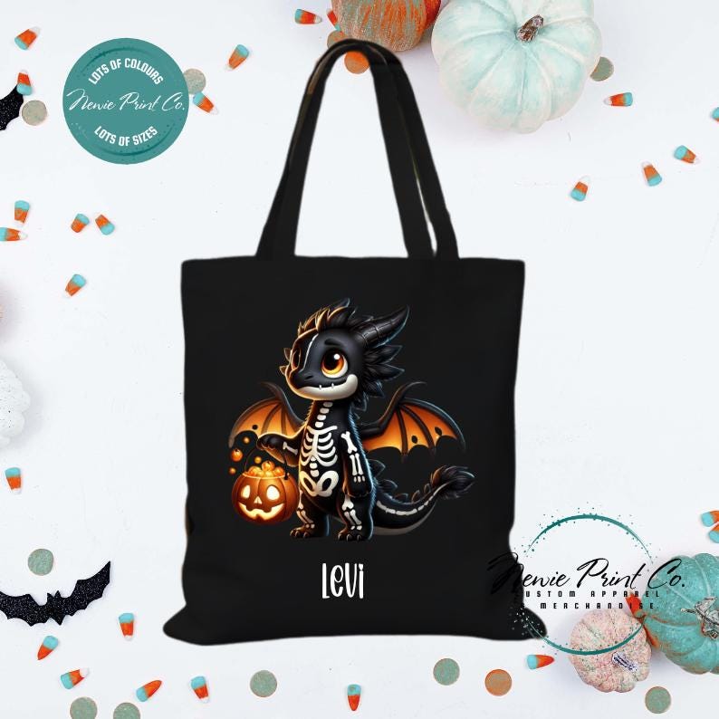 Custom Halloween tote bag with a cute black and orange dragon holding a pumpkin, optional personalised name printed on the front, perfect for trick-or-treating or spooky season gifts Printed in Australia.