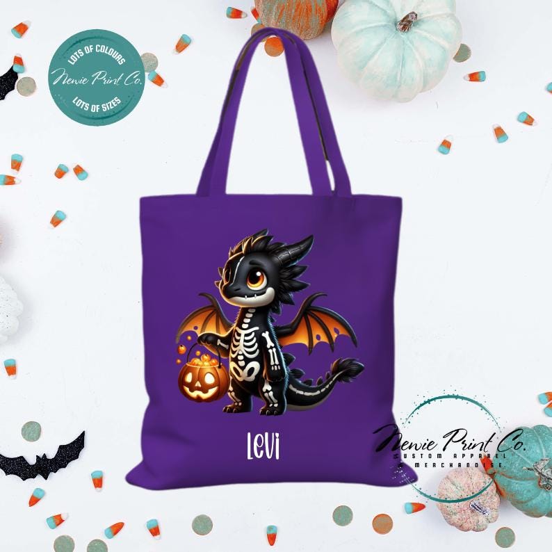 Custom Halloween tote bag with a cute black and orange dragon holding a pumpkin, optional personalised name printed on the front, perfect for trick-or-treating or spooky season gifts Printed in Australia.