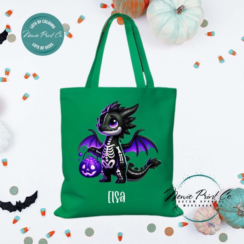 Custom Halloween tote bag with a cute black and purple dragon holding a pumpkin, optional personalised name printed on the front, perfect for trick-or-treating or spooky season gifts printed in Australia.