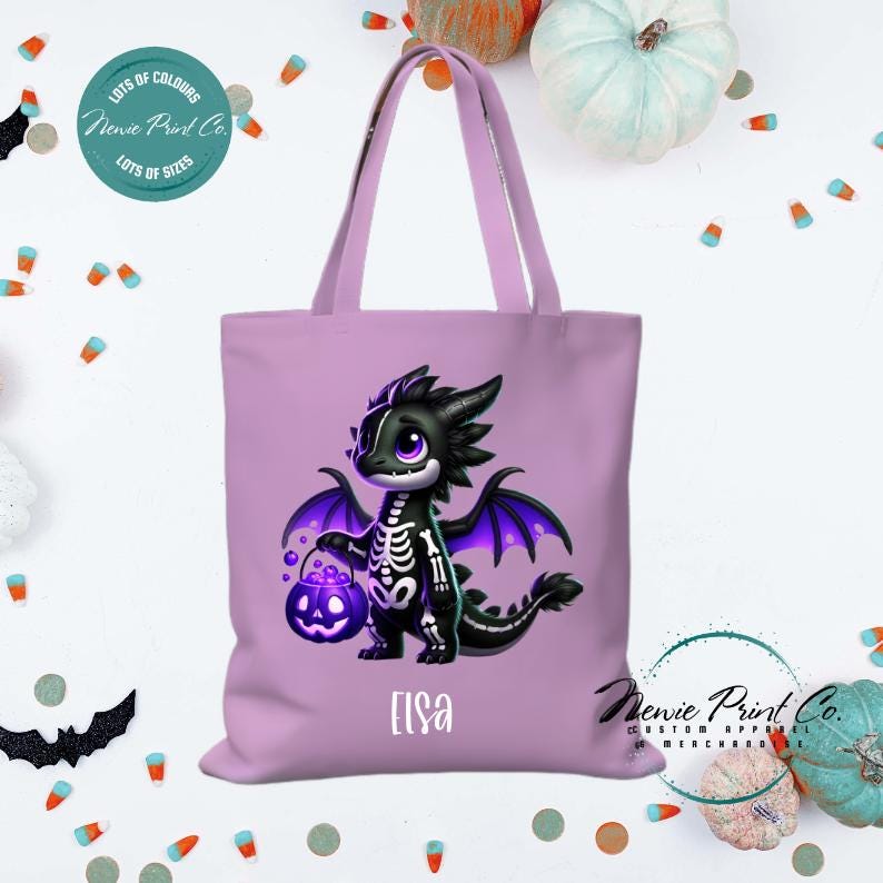 Custom Halloween tote bag with a cute black and purple dragon holding a pumpkin, optional personalised name printed on the front, perfect for trick-or-treating or spooky season gifts printed in Australia.