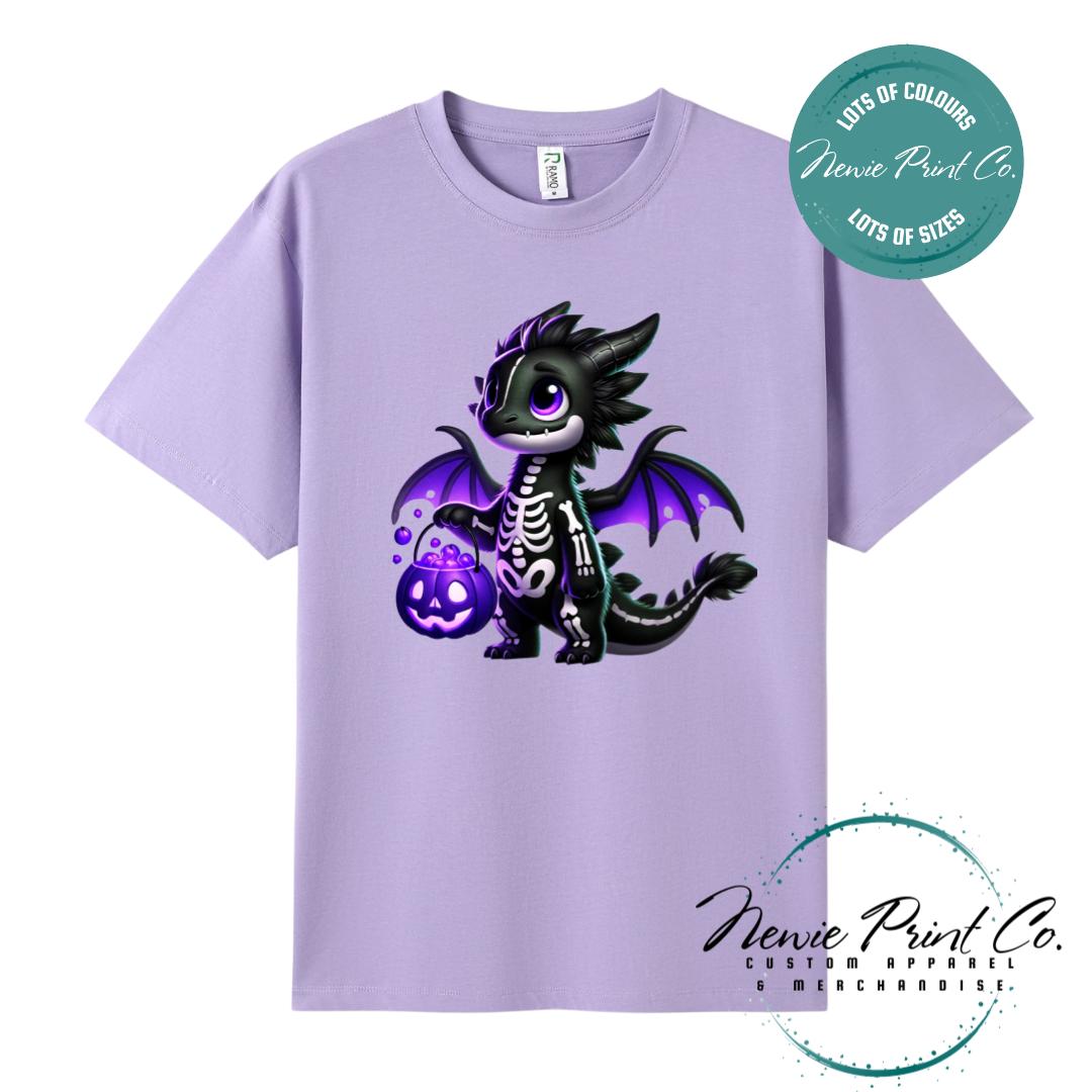 Custom Halloween t-shirts printed in Australia, featuring a cute but spooky black and purple dragon, and optional personalised names underneath - perfect for Halloween parties, school events, or family matching outfits.