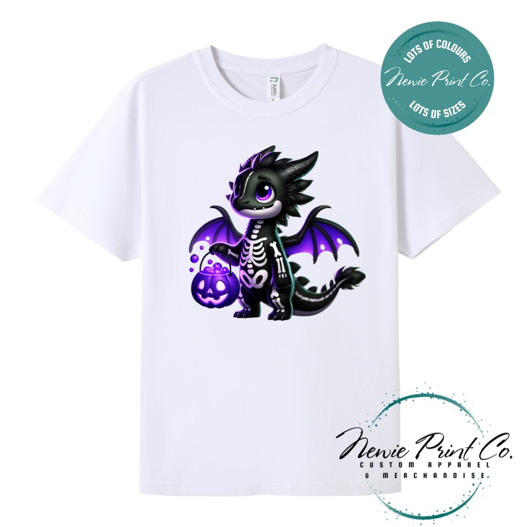 Custom Halloween t-shirts printed in Australia, featuring a cute but spooky black and purple dragon, and optional personalised names underneath - perfect for Halloween parties, school events, or family matching outfits.