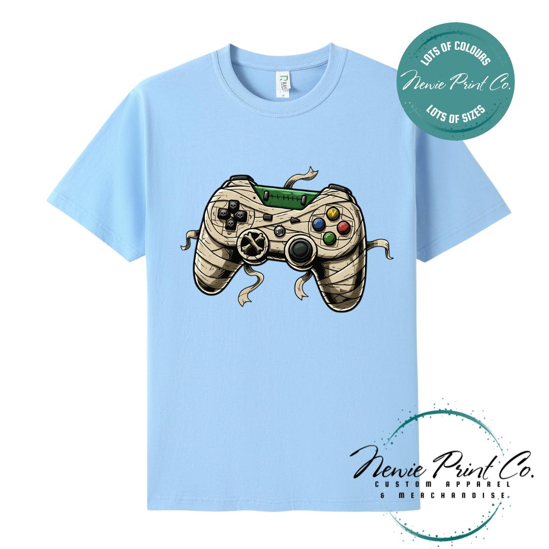 Custom Halloween t-shirts printed in Australia, featuring a spooky gamer design and optional personalised names — perfect for Halloween parties, school events, or family matching outfits.