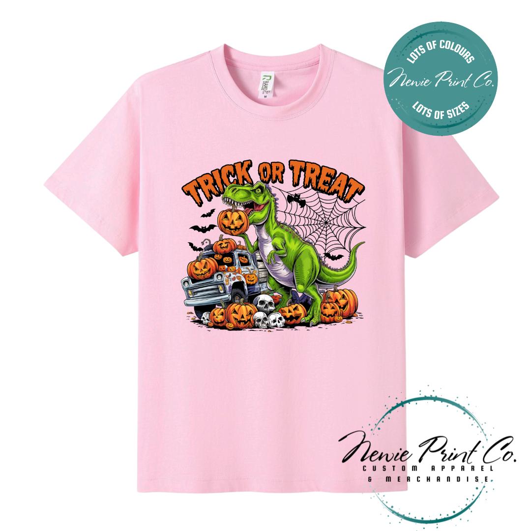 Custom Halloween t-shirts printed in Australia, featuring a spooky dinosaur and monster truck design and optional personalised names — perfect for Halloween parties, school events, or family matching outfits.