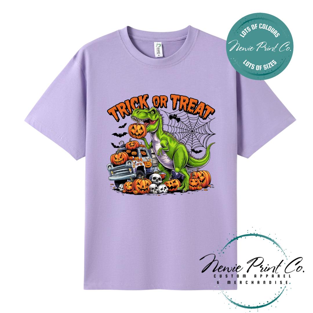 Custom Halloween t-shirts printed in Australia, featuring a spooky dinosaur and monster truck design and optional personalised names — perfect for Halloween parties, school events, or family matching outfits.