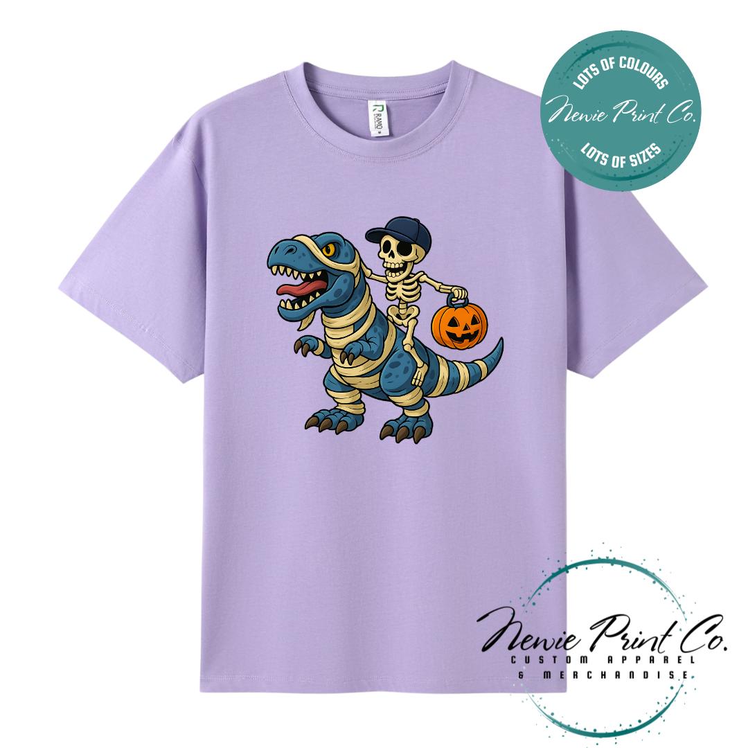 Custom Halloween t-shirts printed by Newie Print Co, featuring spooky designs and optional personalised names — perfect for Halloween parties, school events, or family matching outfits.