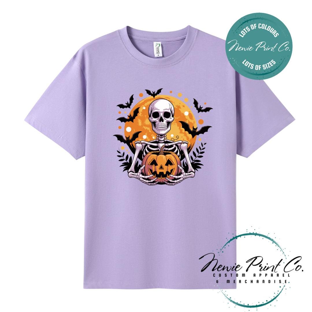 Custom Halloween t-shirts printed by Newie Print Co, featuring spooky skeleton design and optional personalised names — perfect for Halloween parties, school events, or family matching outfits.