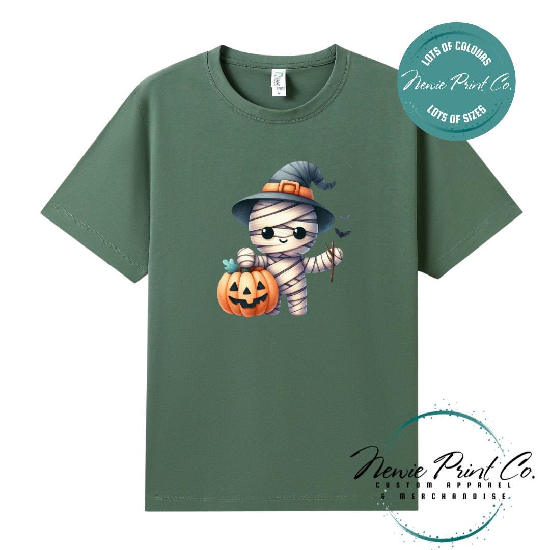 Custom Halloween t-shirts printed in Australia, featuring a cute but spooky mummy witch design and optional personalised names — perfect for Halloween parties, school events, or family matching outfits.
