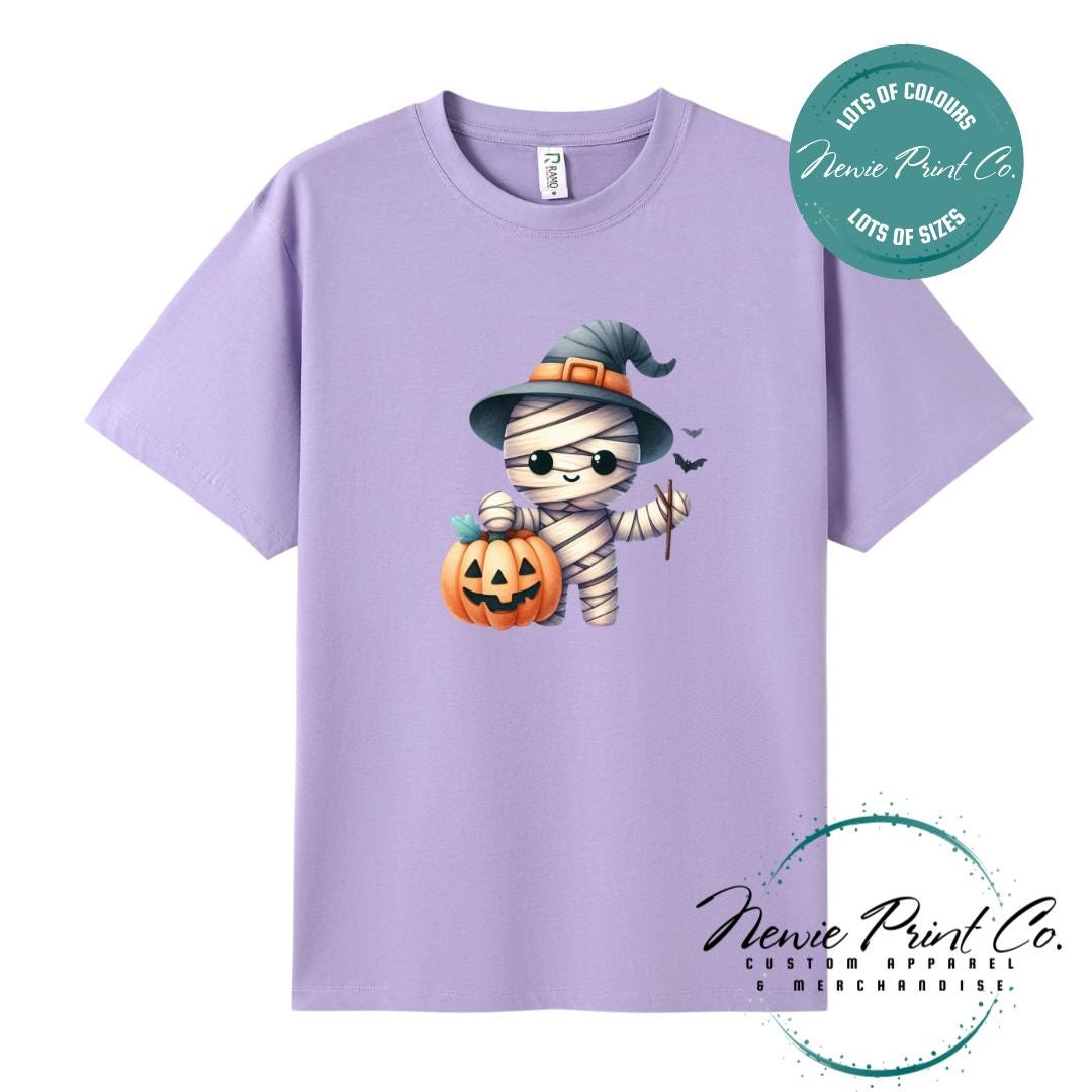 Custom Halloween t-shirts printed in Australia, featuring a cute but spooky mummy witch design and optional personalised names — perfect for Halloween parties, school events, or family matching outfits.