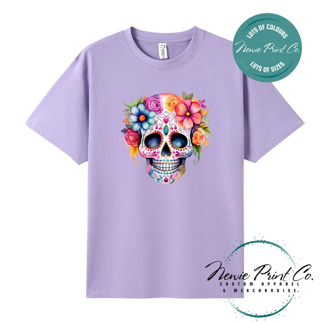 Custom Halloween t-shirts printed in Australia, featuring a floral sugar skull design and optional personalised names — perfect for Halloween parties, school events, or family matching outfits.