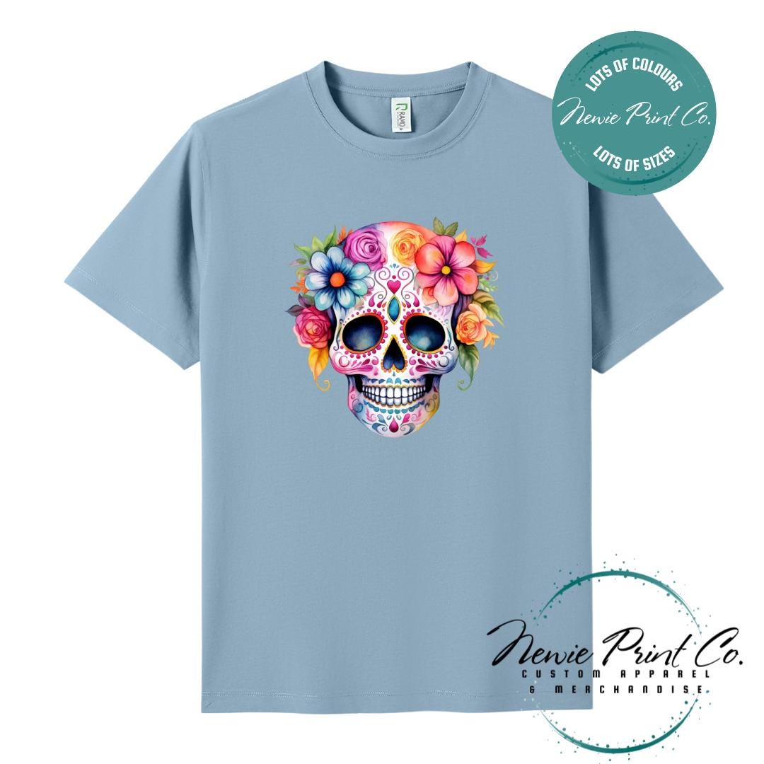 Custom Halloween t-shirts printed in Australia, featuring a floral sugar skull design and optional personalised names — perfect for Halloween parties, school events, or family matching outfits.