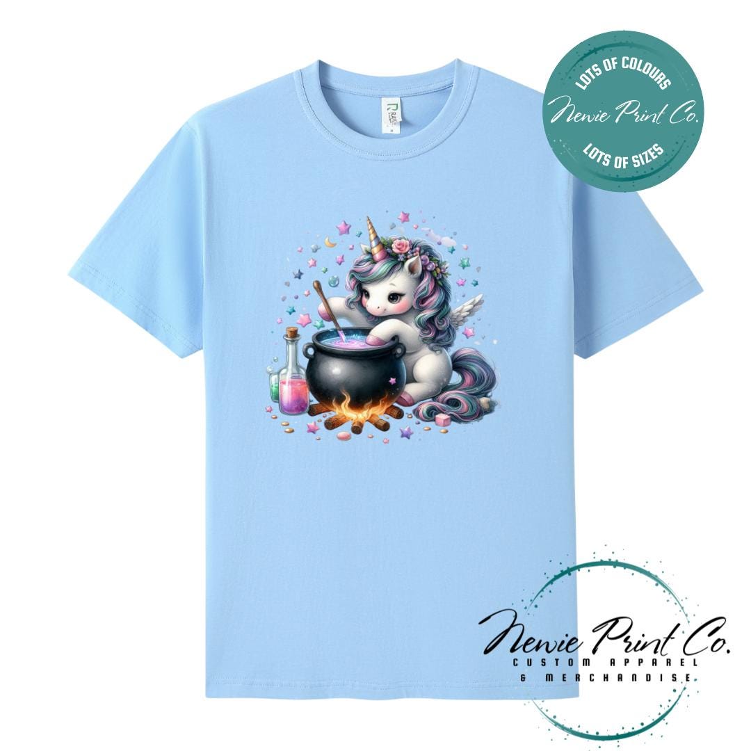 Custom Halloween t-shirts printed in Australia, featuring a cute and spooky unicorn and cauldron design and optional personalised names — perfect for Halloween parties, school events, or family matching outfits.