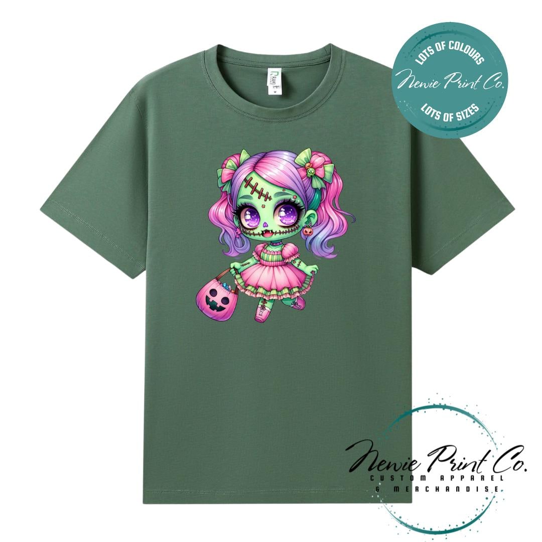 Custom Halloween t-shirts printed by in Australia by Newie Print Co, featuring a cute and spooky zombie girl dressed in pink and purple and optional personalised names — perfect for Halloween parties, school events, or family matching outfits.