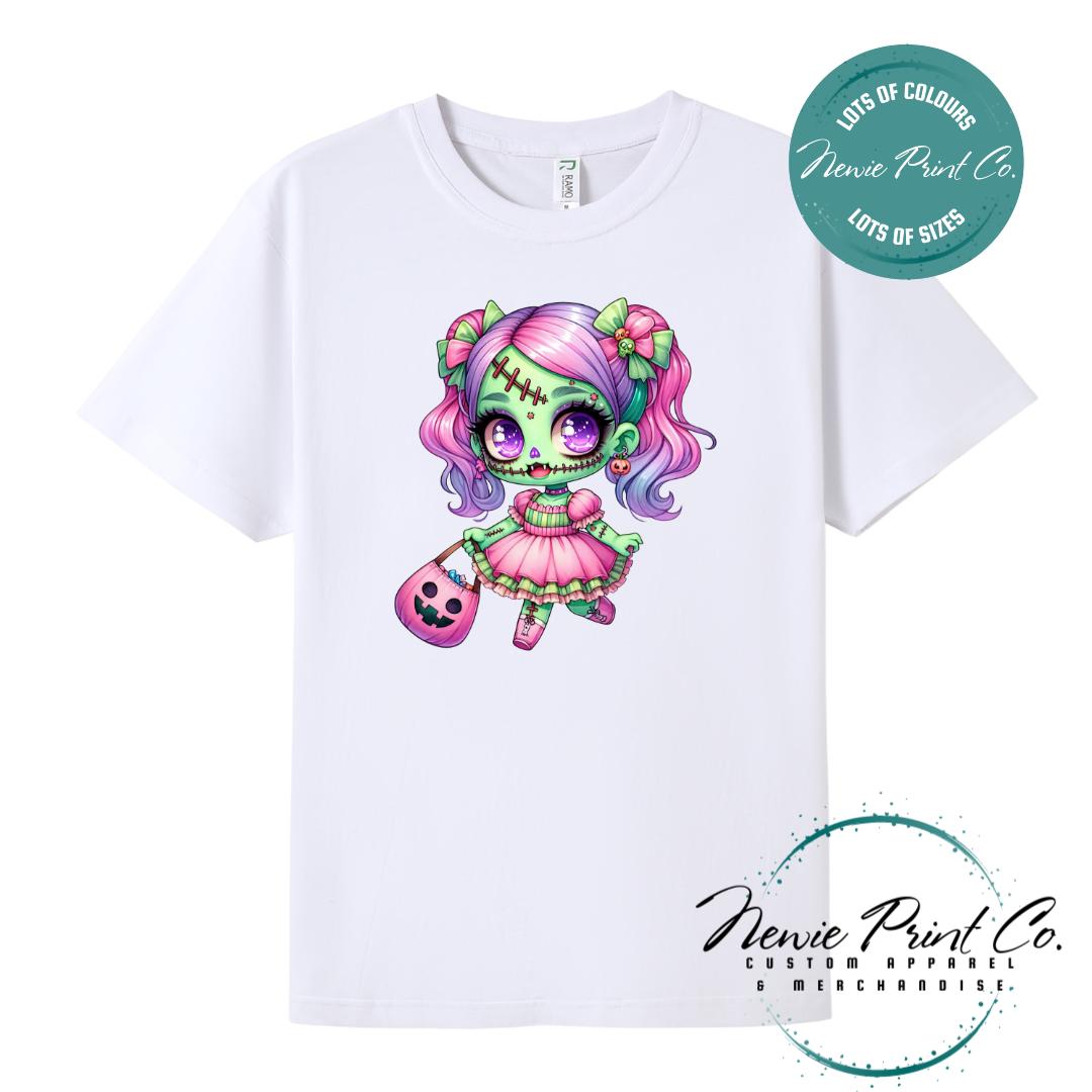 Custom Halloween t-shirts printed by in Australia by Newie Print Co, featuring a cute and spooky zombie girl dressed in pink and purple and optional personalised names — perfect for Halloween parties, school events, or family matching outfits.