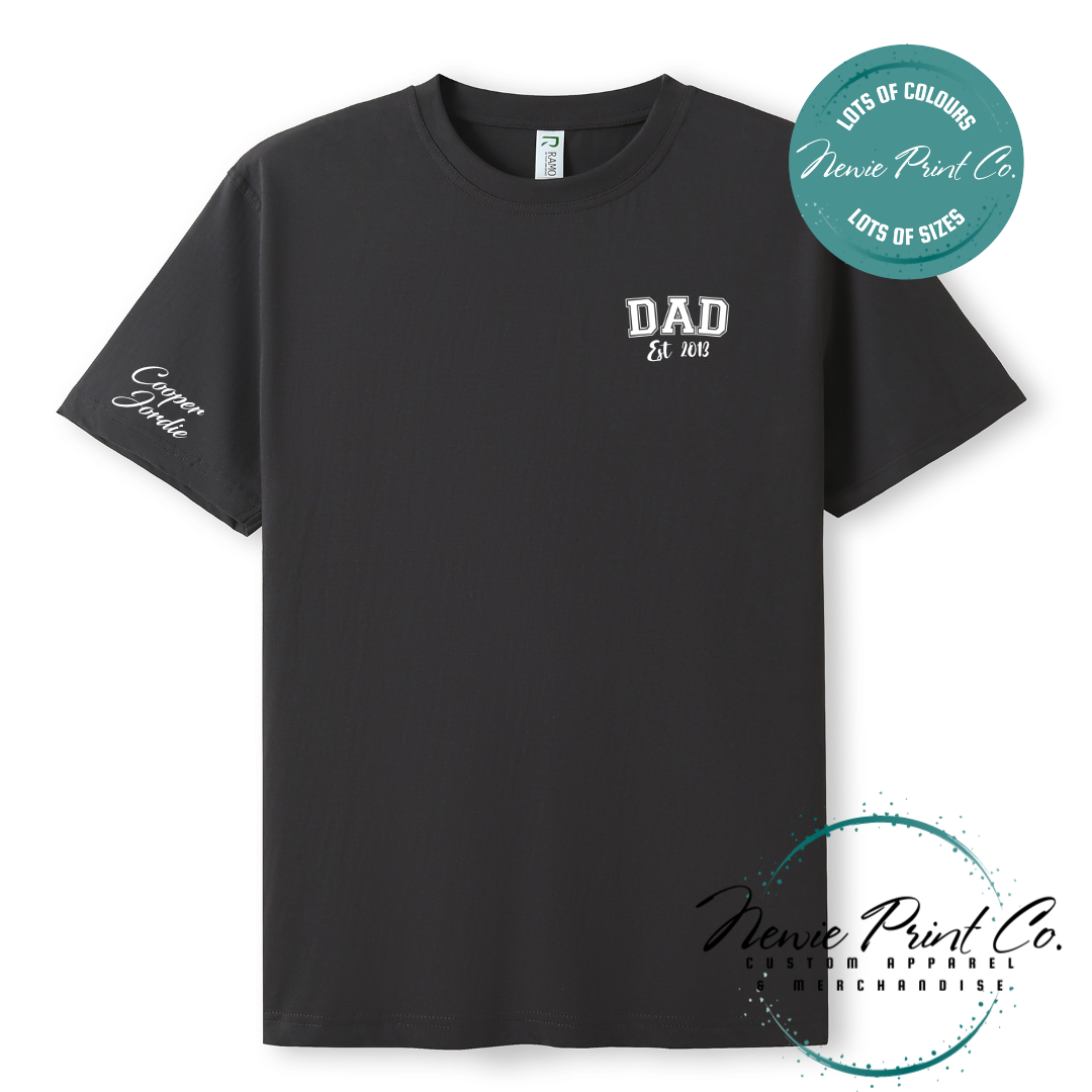 Personalised Dad t-shirt and jumper with “Dad Est. [Year]” on the chest and kids' names printed on the sleeve. Custom Father’s Day gift made from soft cotton, featuring high-quality DTF/DTG print. Unique gift for dads, birthdays, or new fathers.