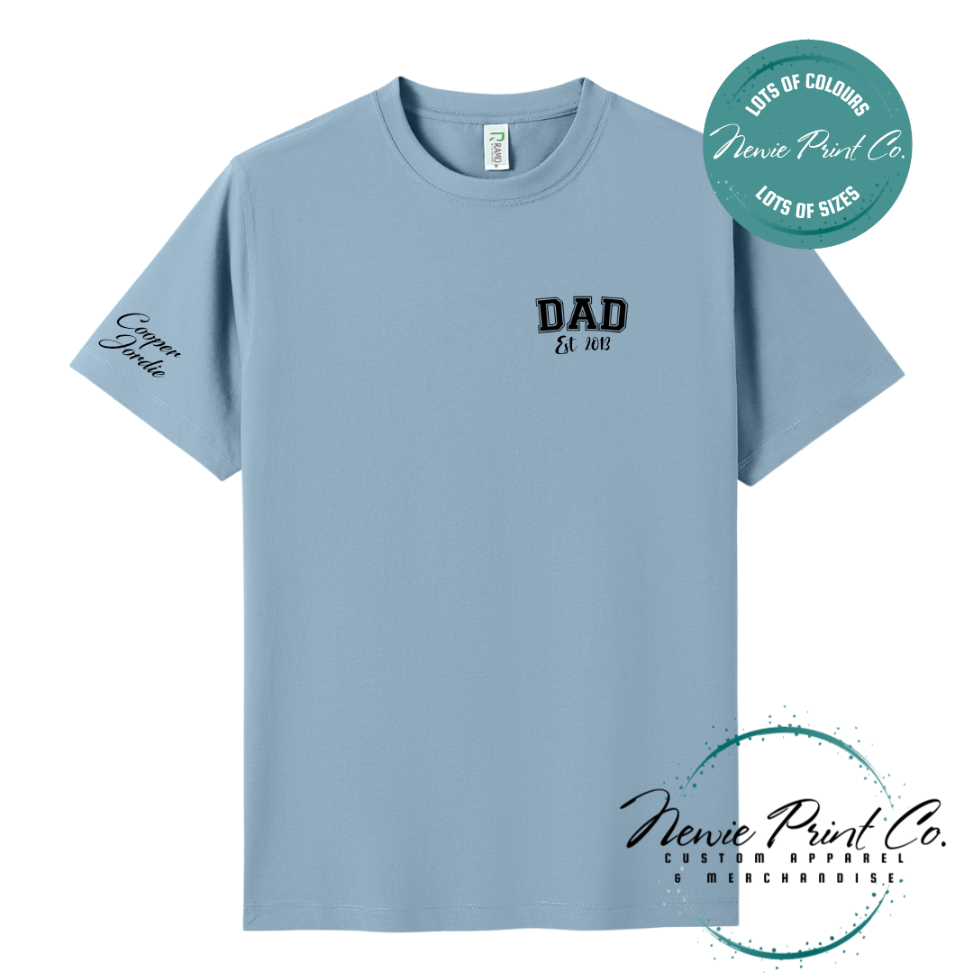 Personalised Dad t-shirt and jumper with “Dad Est. [Year]” on the chest and kids' names printed on the sleeve. Custom Father’s Day gift made from soft cotton, featuring high-quality DTF/DTG print. Unique gift for dads, birthdays, or new fathers.