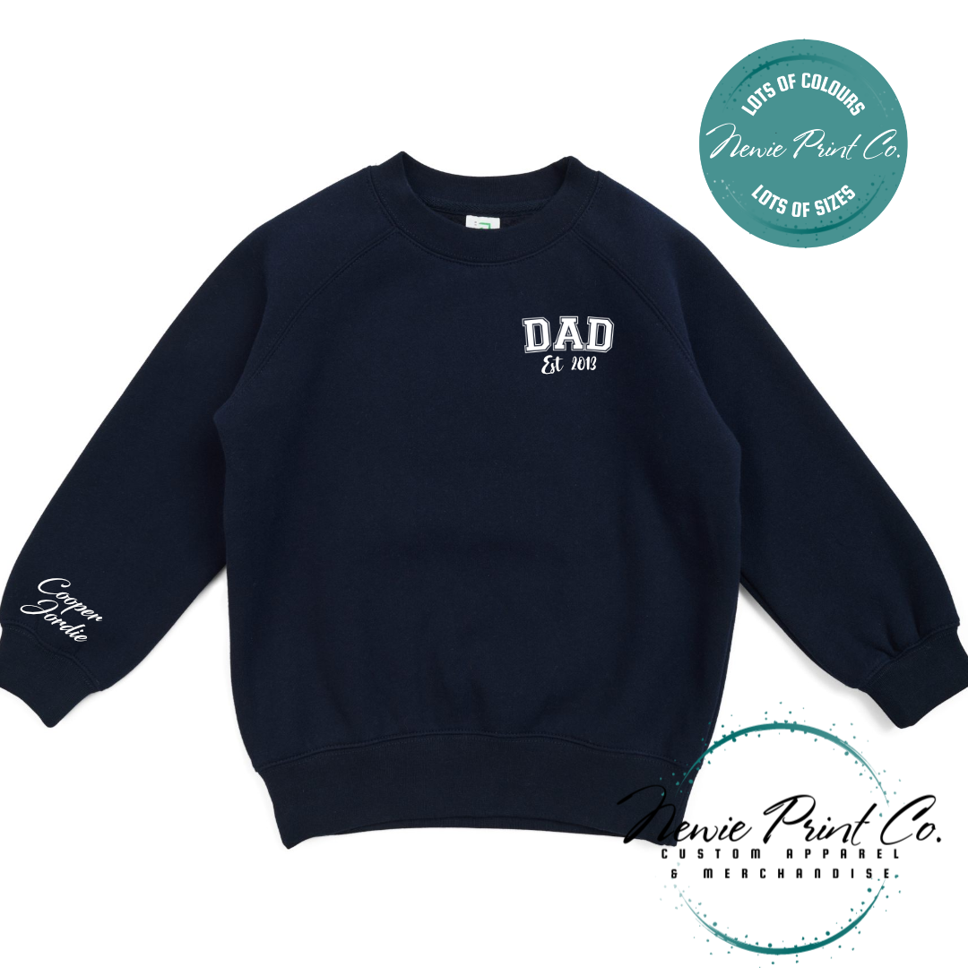 Personalised Dad t-shirt and jumper with “Dad Est. [Year]” on the chest and kids' names printed on the sleeve. Custom Father’s Day gift made from soft cotton, featuring high-quality DTF/DTG print. Unique gift for dads, birthdays, or new fathers.