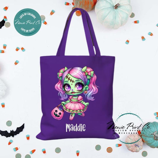 Custom Halloween tote bag with a cute zombie girl dressed in pink and purple, optional personalised name printed on the front, perfect for trick-or-treating or spooky season gifts