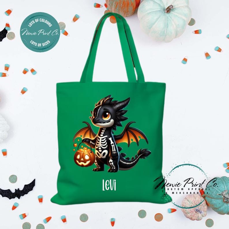 Custom Halloween tote bag with a cute black and orange dragon holding a pumpkin, optional personalised name printed on the front, perfect for trick-or-treating or spooky season gifts Printed in Australia.