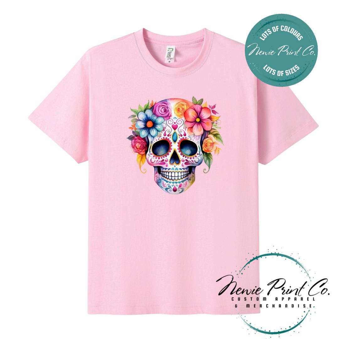 Custom Halloween t-shirts printed in Australia, featuring a floral sugar skull design and optional personalised names — perfect for Halloween parties, school events, or family matching outfits.