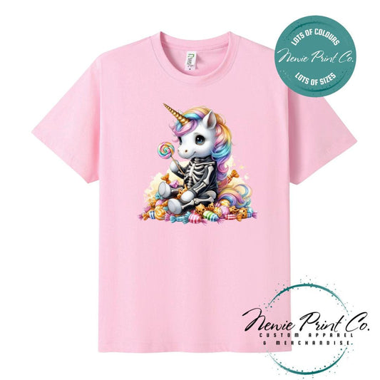 Custom Halloween t-shirts printed in Australia, featuring a cute but spooky unicorn dressed a skeleton sitting on a pile of candy design and optional personalised names — perfect for Halloween parties, school events, or family matching outfits.