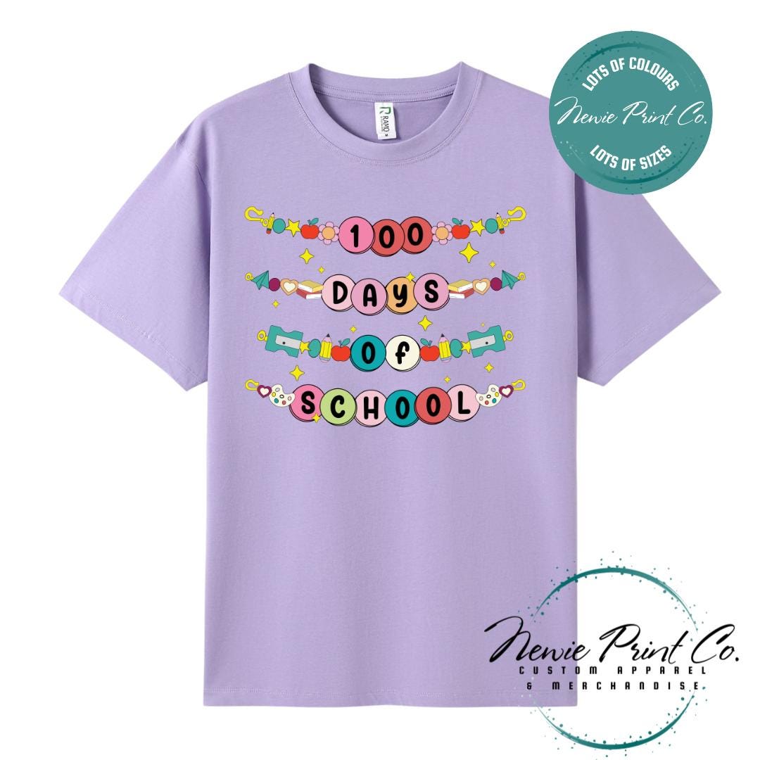 Lavender 100 Days of School t-shirt featuring a colourful friendship bracelet  with the text “100 Days of School,” designed for students or teachers to celebrate the 100th day of school milestone in a fun, playful way. Available in both adult and kids sizes.