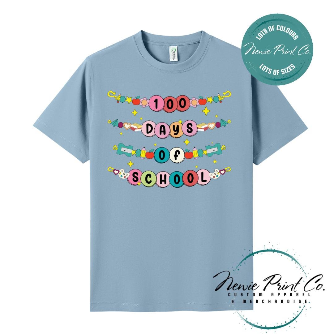 Seafoam Blue 100 Days of School t-shirt featuring a colourful friendship bracelet with the text “100 Days of School,” designed for students or teachers to celebrate the 100th day of school milestone in a fun, playful way. Available in both adult and kids sizes.
