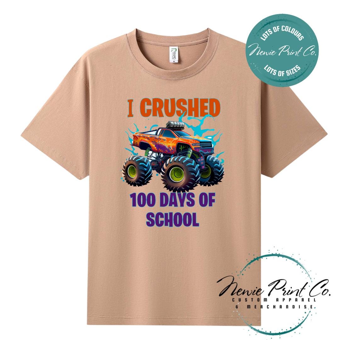 Peach 100 Days of School t-shirt featuring a bold monster truck graphic with the text “I Crushed 100 Days of School,” designed for students or teachers to celebrate the 100th day of school milestone in a fun, playful way. Available in both adult and kids sizes.
